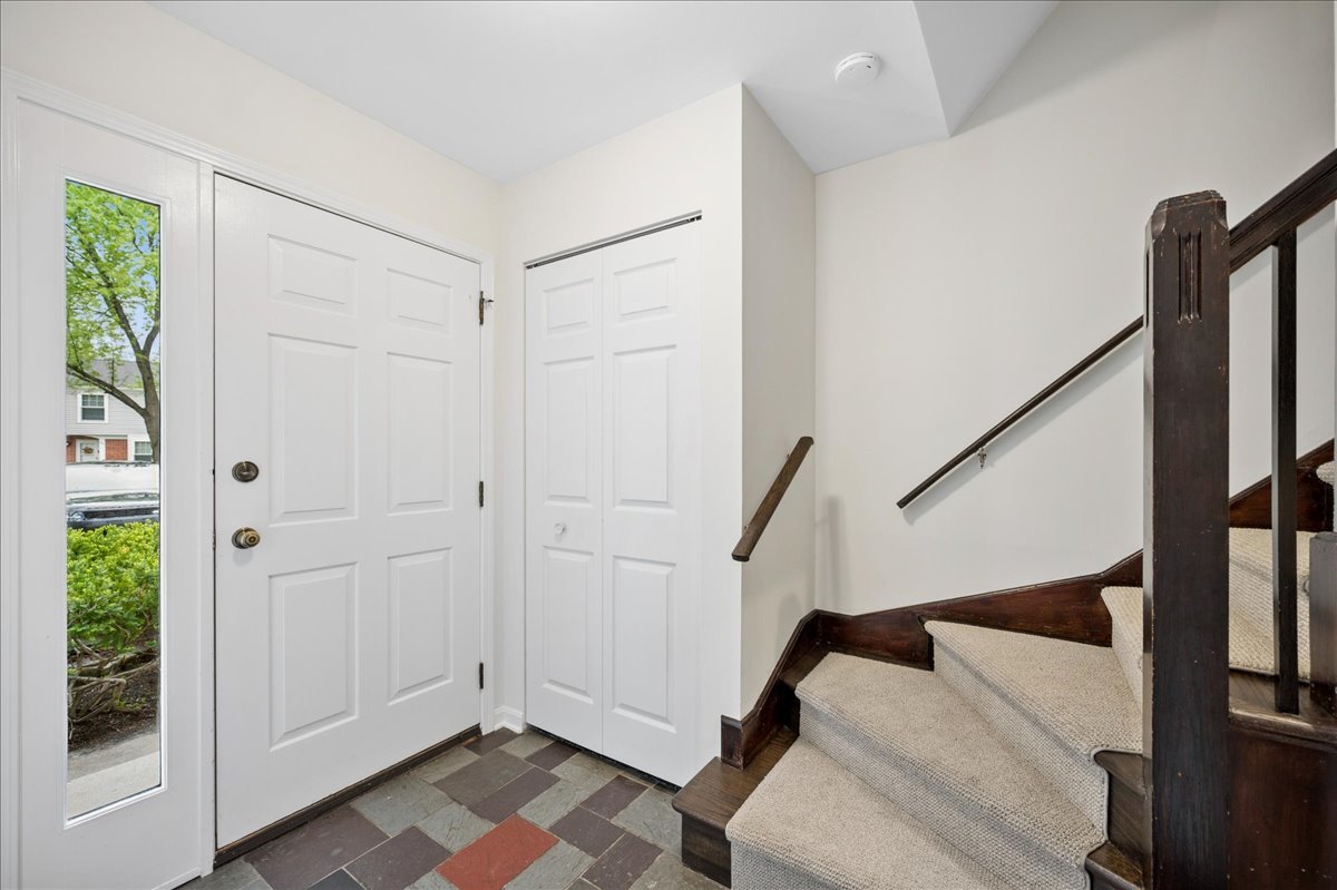1701 Colonial Lane Northfield, IL 60093 - Photo 2 of 20 a view of entryway with stairs and wooden floor