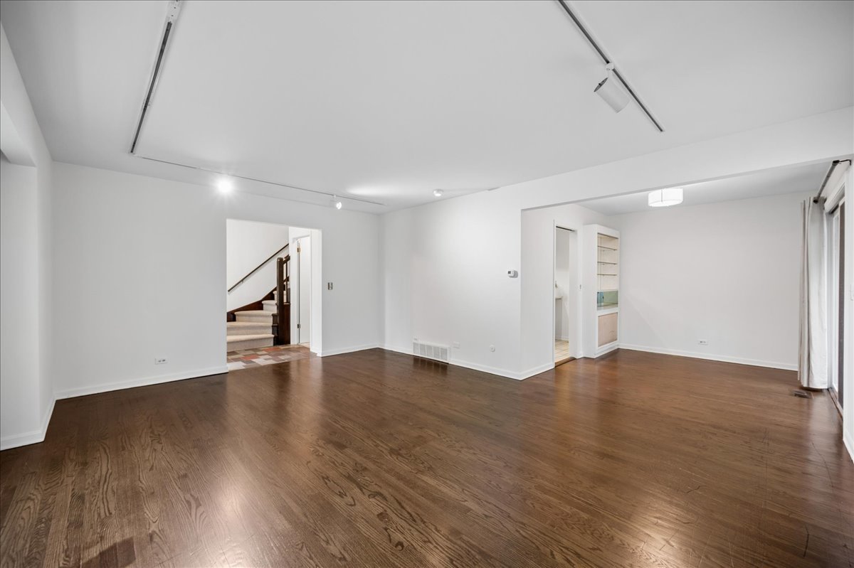 1701 Colonial Lane Northfield, IL 60093 - Photo 4 of 20 a view of an empty room with wooden floor