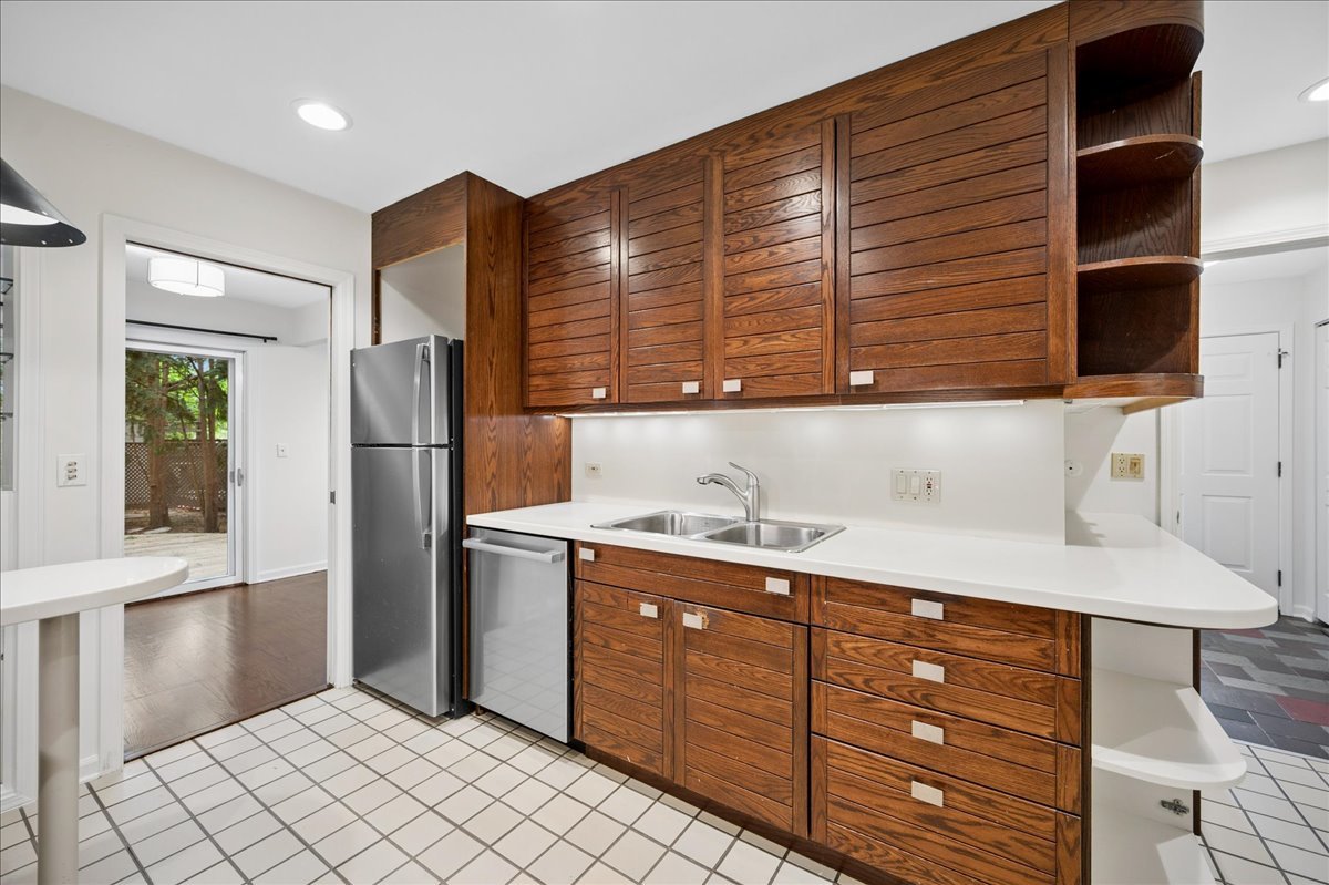 1701 Colonial Lane Northfield, IL 60093 - Photo 10 of 20 a kitchen with a refrigerator and a sink