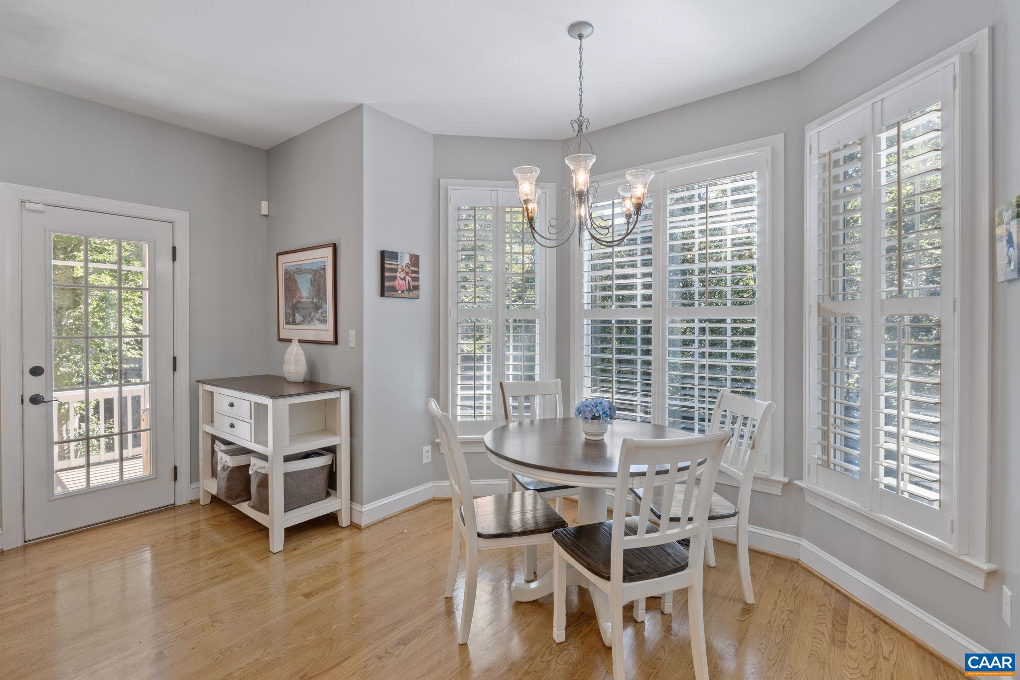 2370 Walnut Ridge Lane Charlottesville, VA 22911 - Photo 11 of 61 a view of a dining room with furniture window and outside view