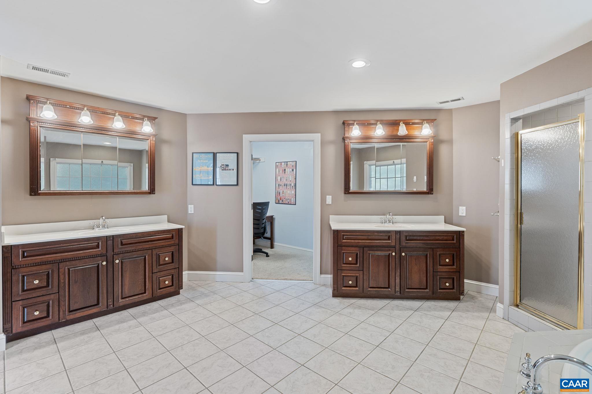 2370 Walnut Ridge Lane Charlottesville, VA 22911 - Photo 27 of 61 a spacious bathroom with a granite countertop double vanity sink mirror and a bathtub