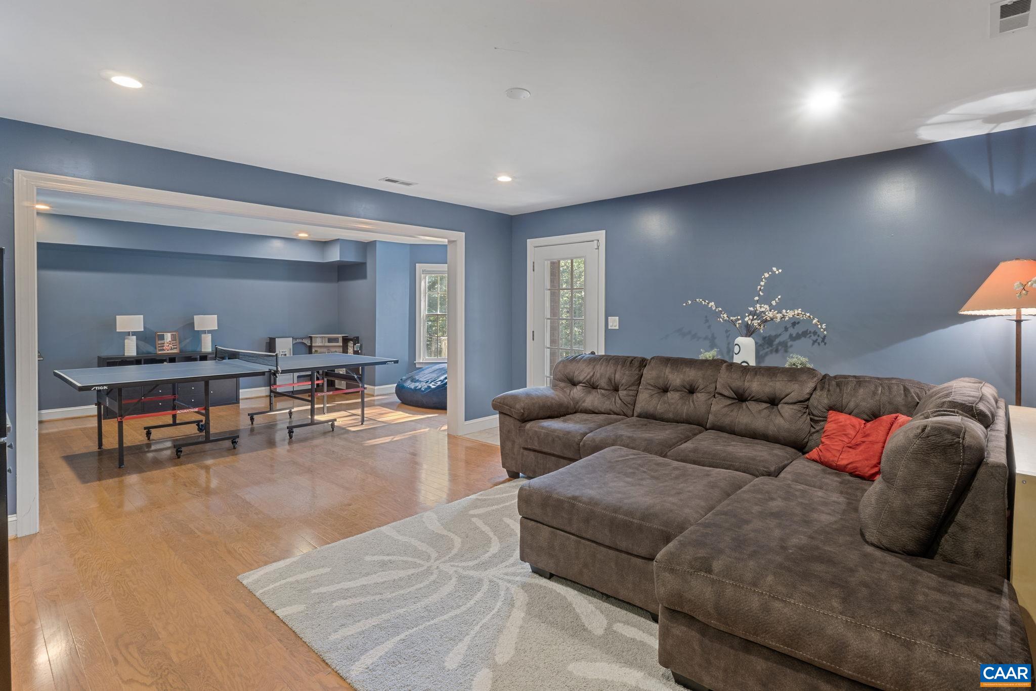 2370 Walnut Ridge Lane Charlottesville, VA 22911 - Photo 36 of 61 a living room with furniture and kitchen view