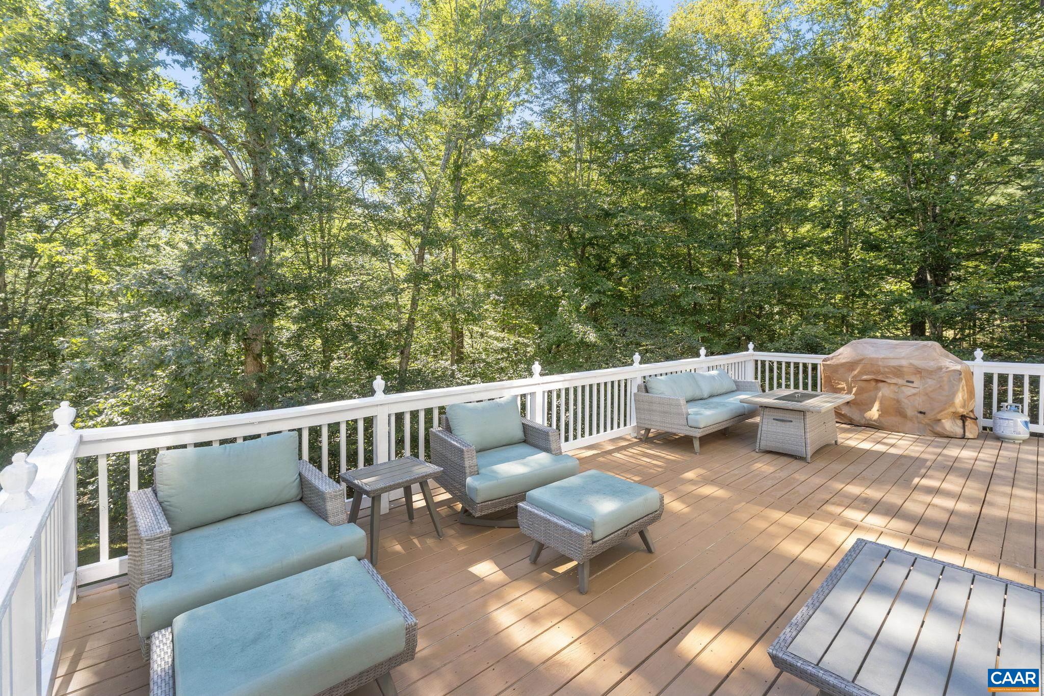 2370 Walnut Ridge Lane Charlottesville, VA 22911 - Photo 43 of 61 a balcony with wooden floor and outdoor seating