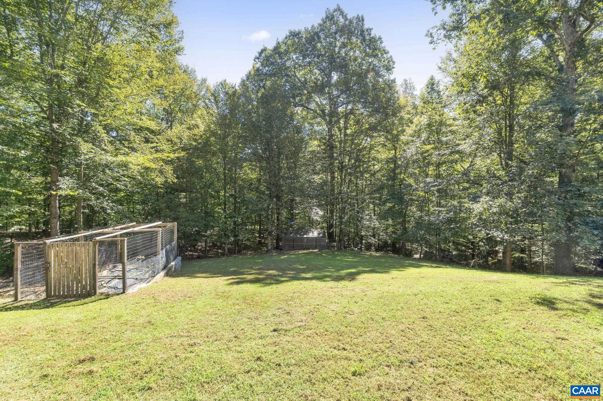 2370 Walnut Ridge Lane Charlottesville, VA 22911 - Photo 46 of 61 a view of a swimming pool with a patio and a yard