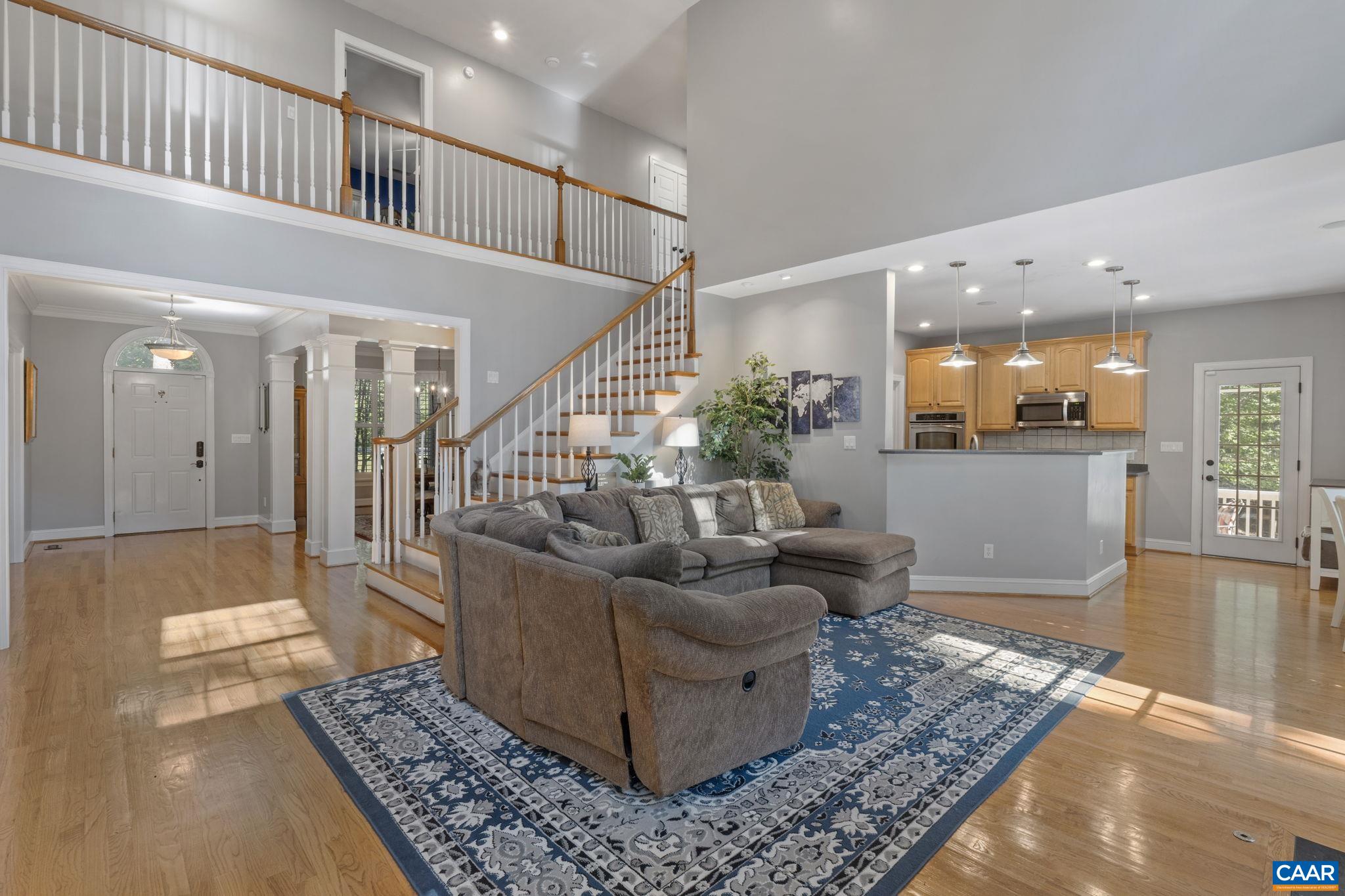 2370 Walnut Ridge Lane Charlottesville, VA 22911 - Photo 7 of 61 a living room with furniture and a rug