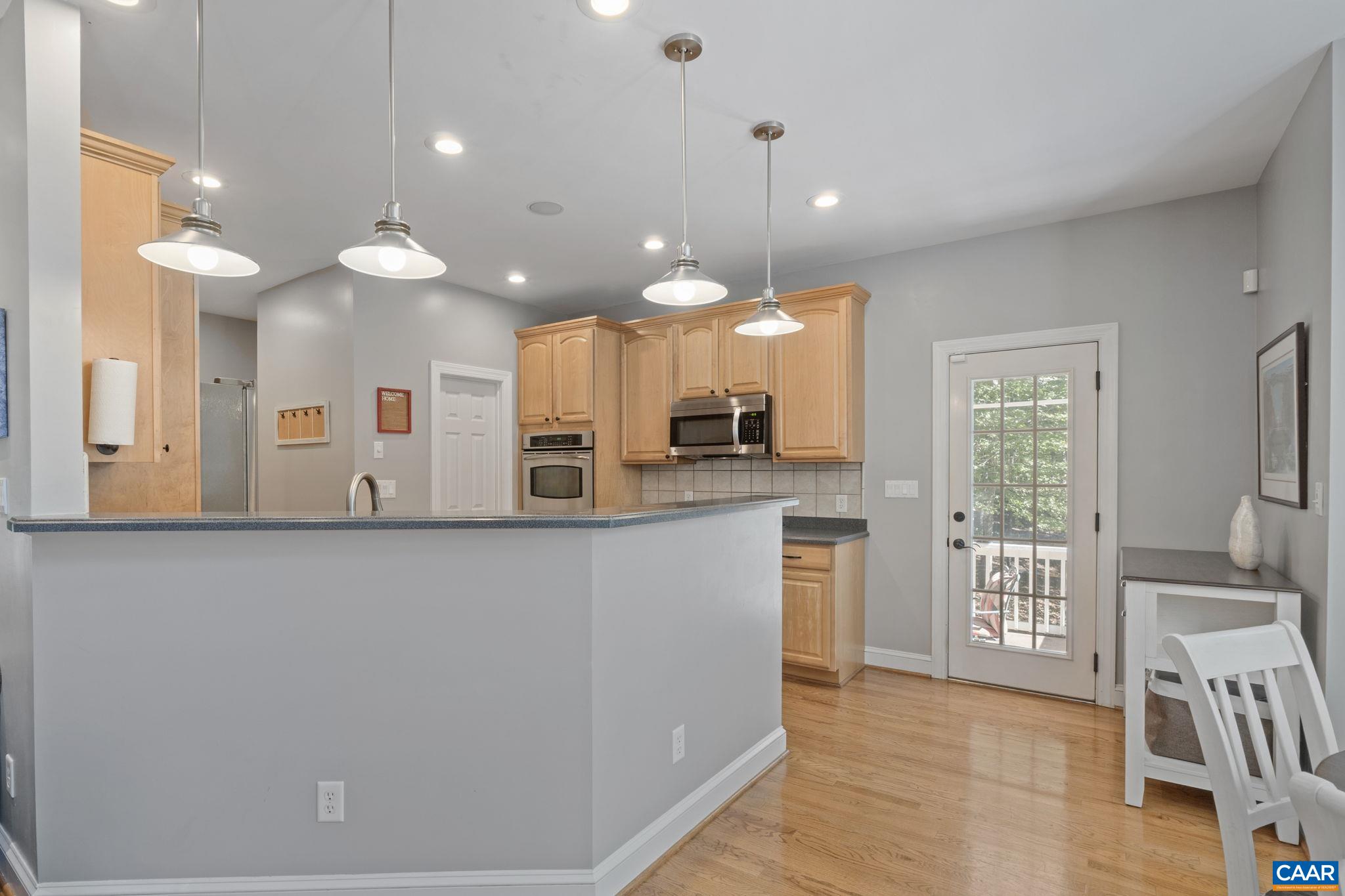 2370 Walnut Ridge Lane Charlottesville, VA 22911 - Photo 10 of 61 a large kitchen with a large window and stainless steel appliances