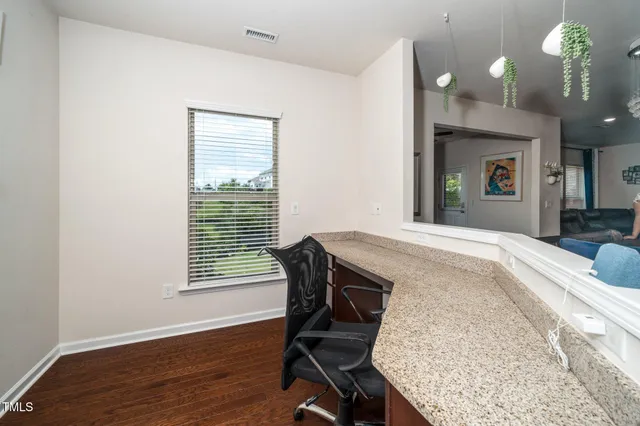 a workspace with furniture and a window