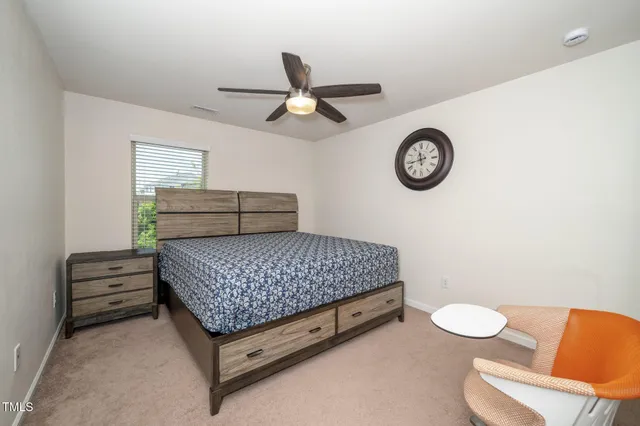 a room with a bed and a chair