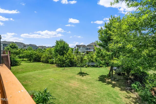 a view of a golf course with a tree
