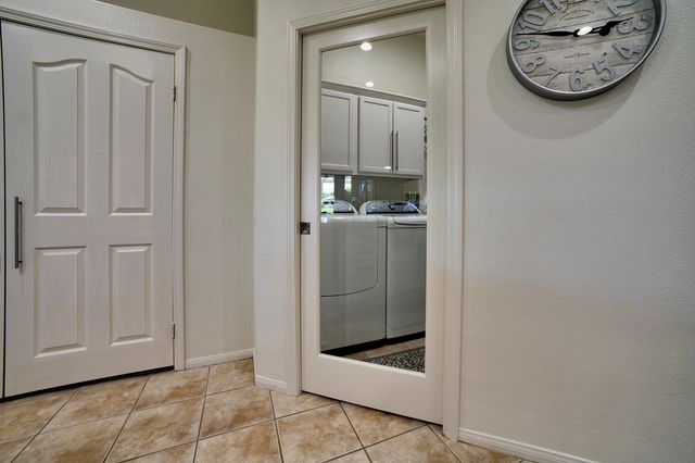 a kitchen with stainless steel appliances granite countertop a refrigerator sink and stove