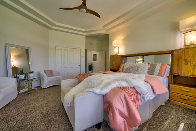 a bathroom with a double vanity sink mirror and bathtub