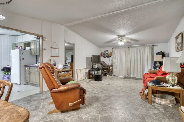 a living room with furniture and a gym