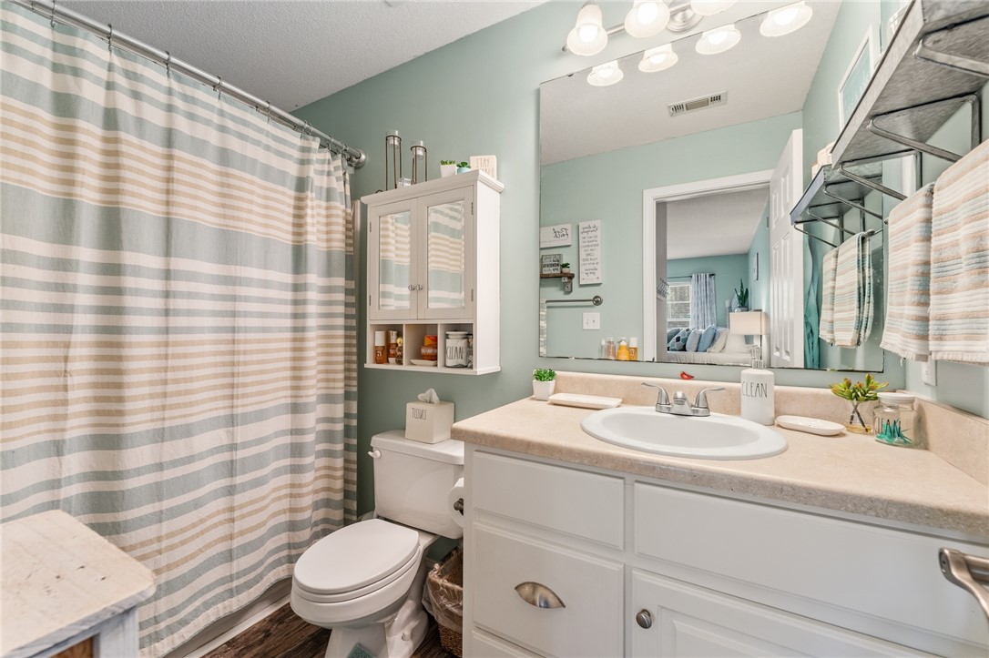 102 Lookover Drive Anderson, SC 29621 - Photo 14 of 27 This bathroom features a sleek vanity and convenient storage solutions for a refreshing daily routine.