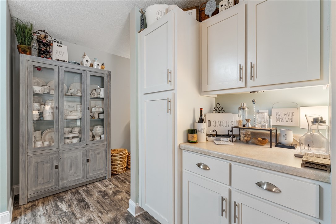 102 Lookover Drive Anderson, SC 29621 - Photo 5 of 27 This kitchen showcases ample white cabinetry and counter space.