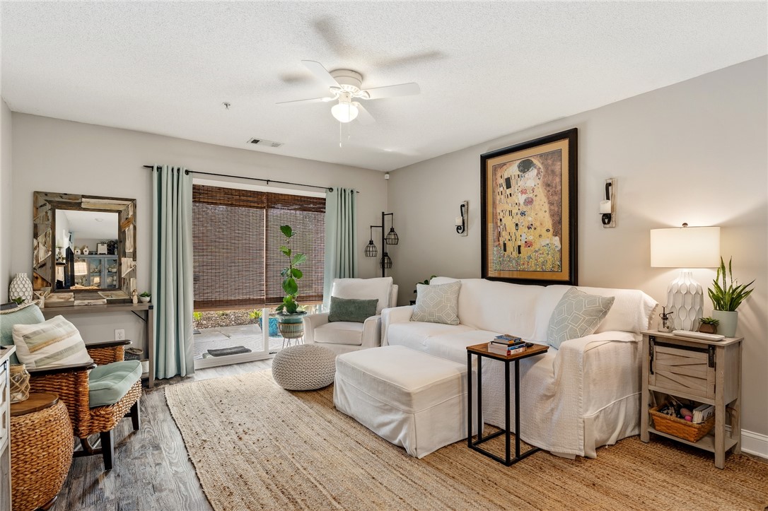 102 Lookover Drive Anderson, SC 29621 - Photo 8 of 27 The bright living space features elegant flooring and a sliding glass door for seamless indoor-outdoor living.