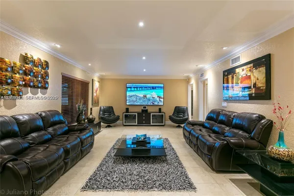 a large kitchen with stainless steel appliances granite countertop a large counter top and a stove