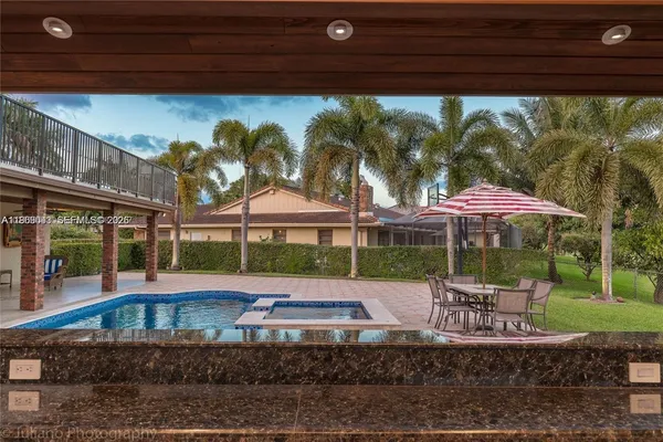 a view of a yard with a patio