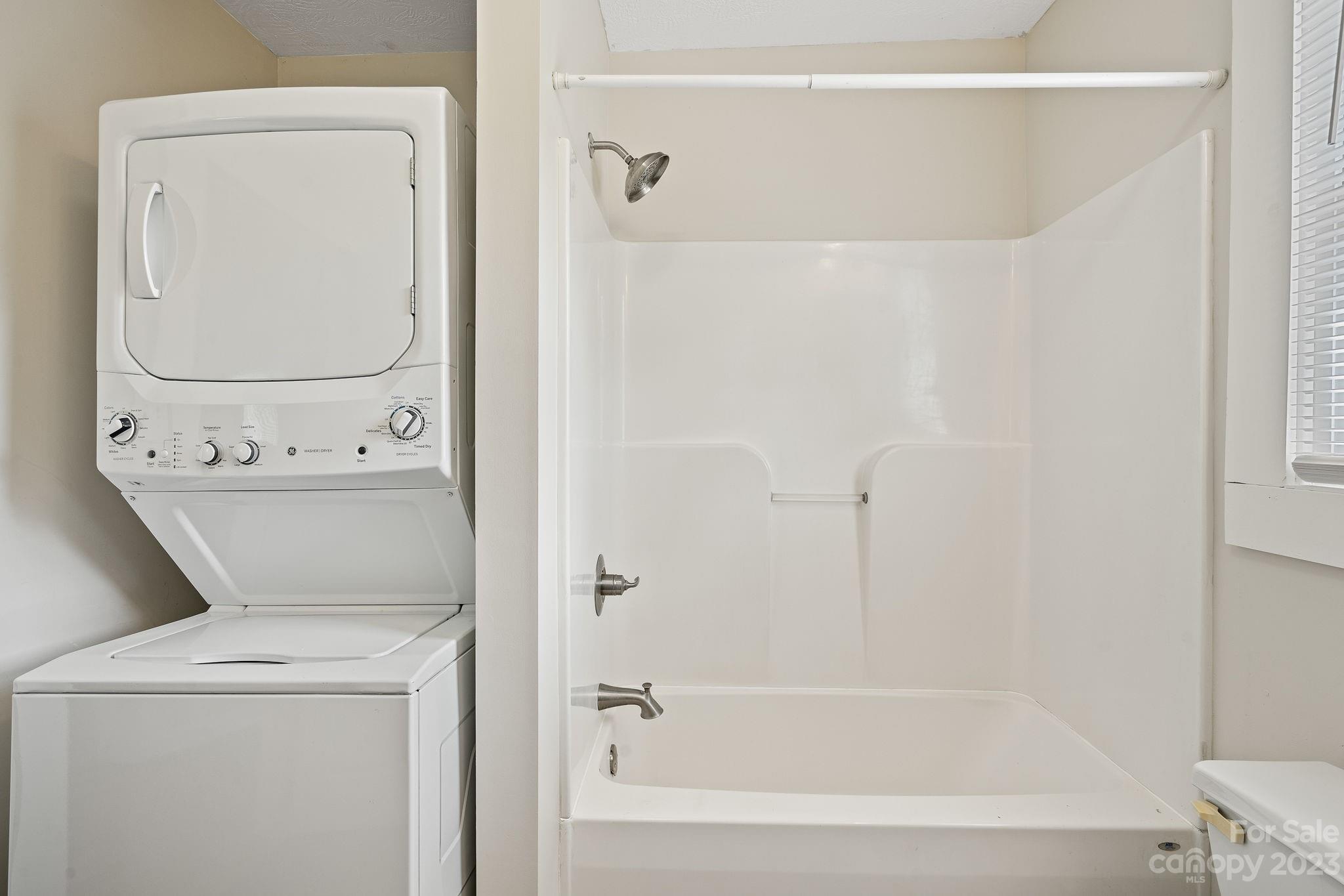 825 Reynolds Road Statesville, NC 28677 - Photo 12 of 26 a bathroom with a bathtub and a sink
