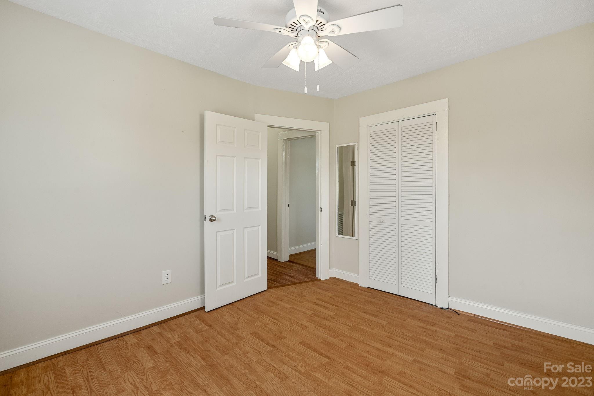 825 Reynolds Road Statesville, NC 28677 - Photo 14 of 26 a view of an empty room with chandelier fan