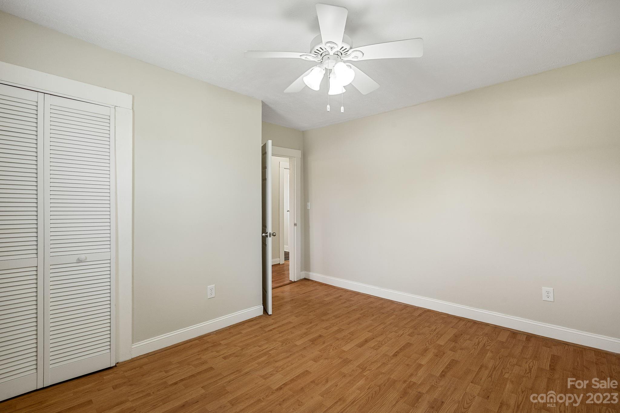 825 Reynolds Road Statesville, NC 28677 - Photo 16 of 26 a view of an empty room with wooden floor