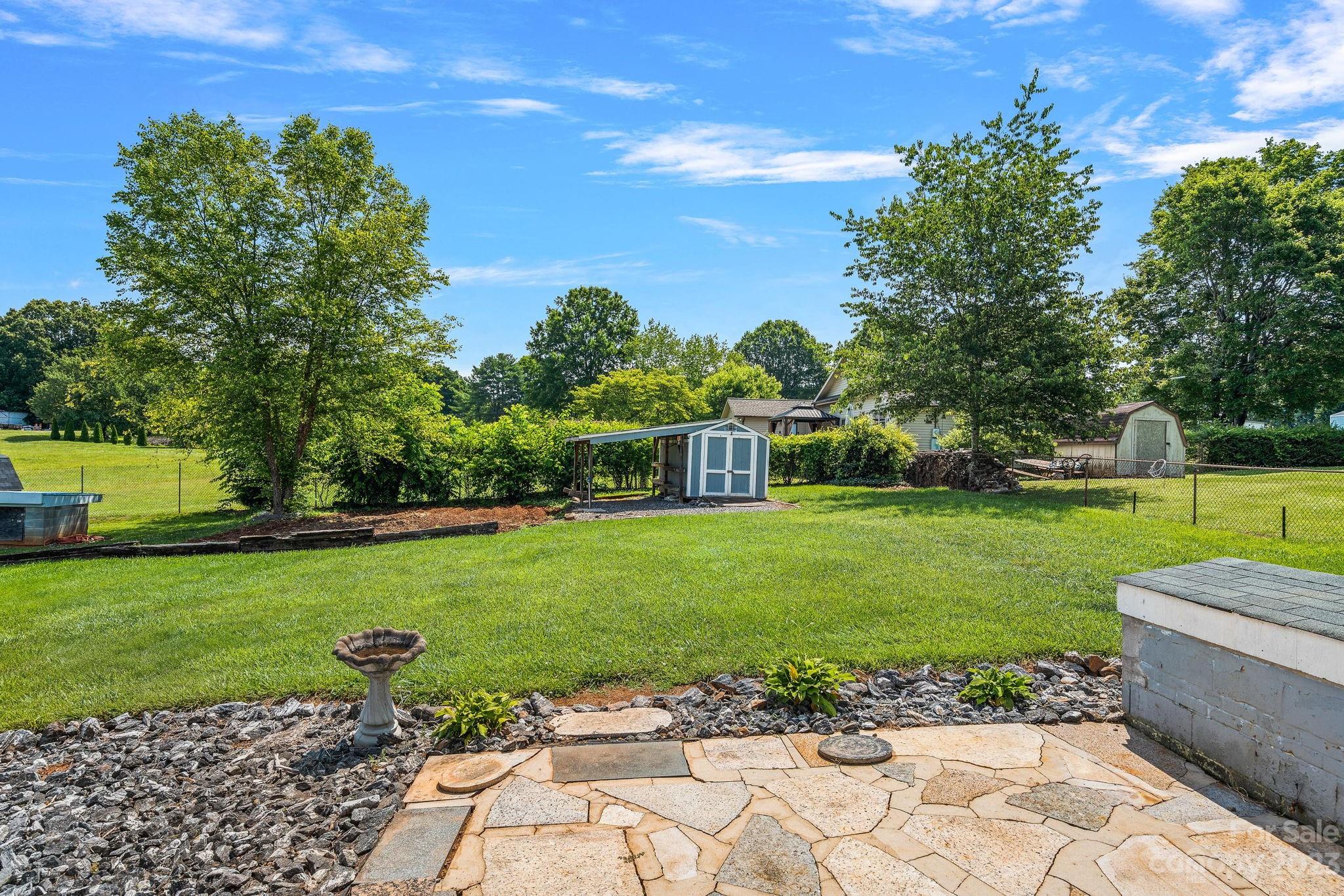 825 Reynolds Road Statesville, NC 28677 - Photo 18 of 26 a view of a garden with a house