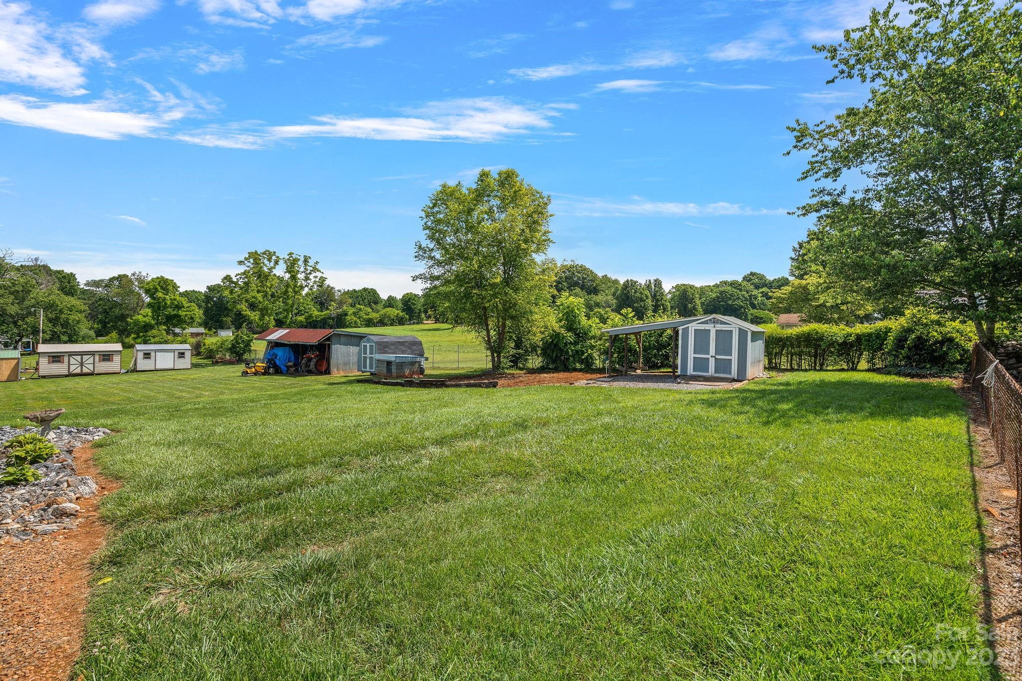 825 Reynolds Road Statesville, NC 28677 - Photo 19 of 26 a view of a house with a yard