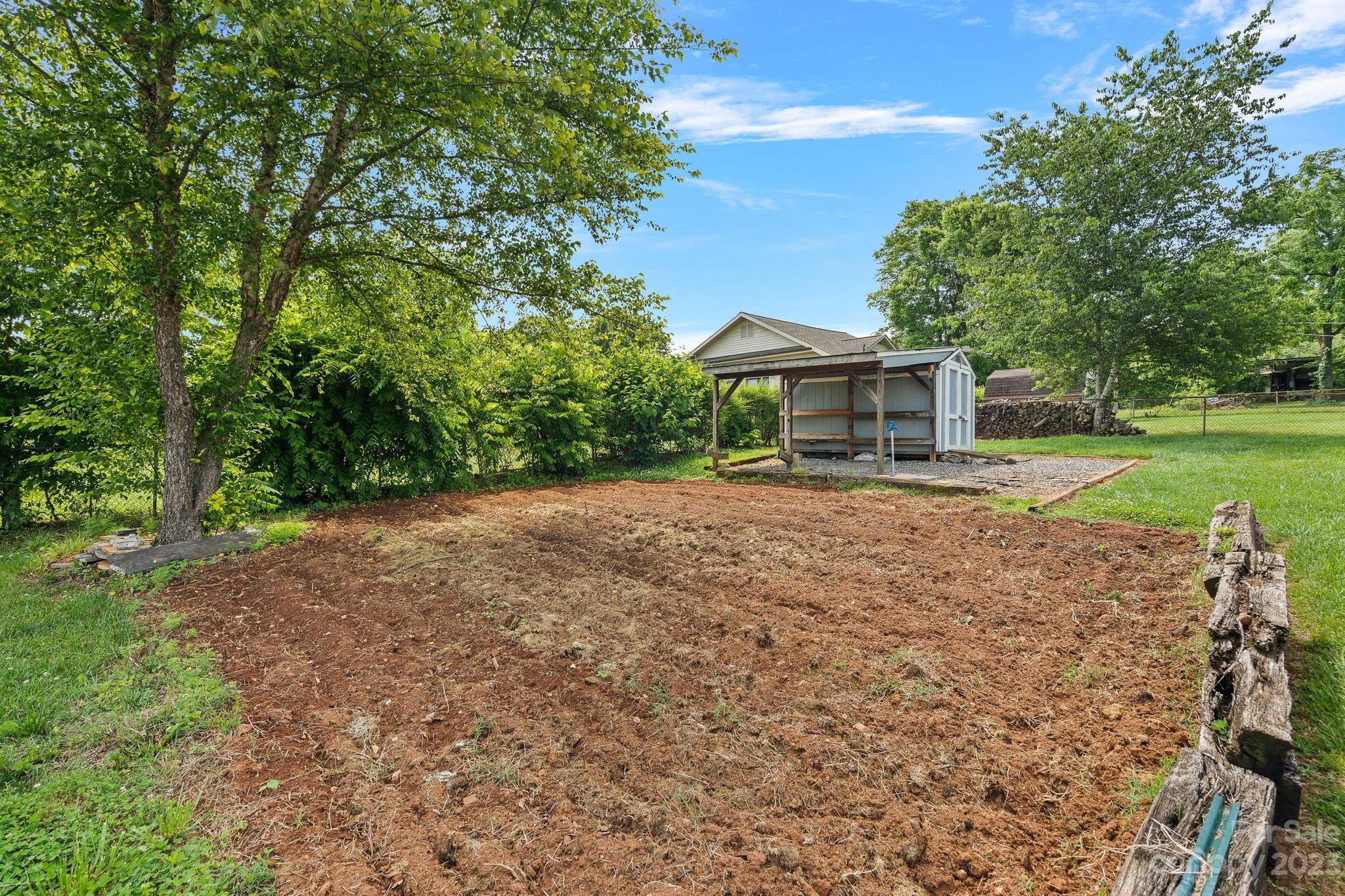 825 Reynolds Road Statesville, NC 28677 - Photo 22 of 26 a front view of a house with a yard