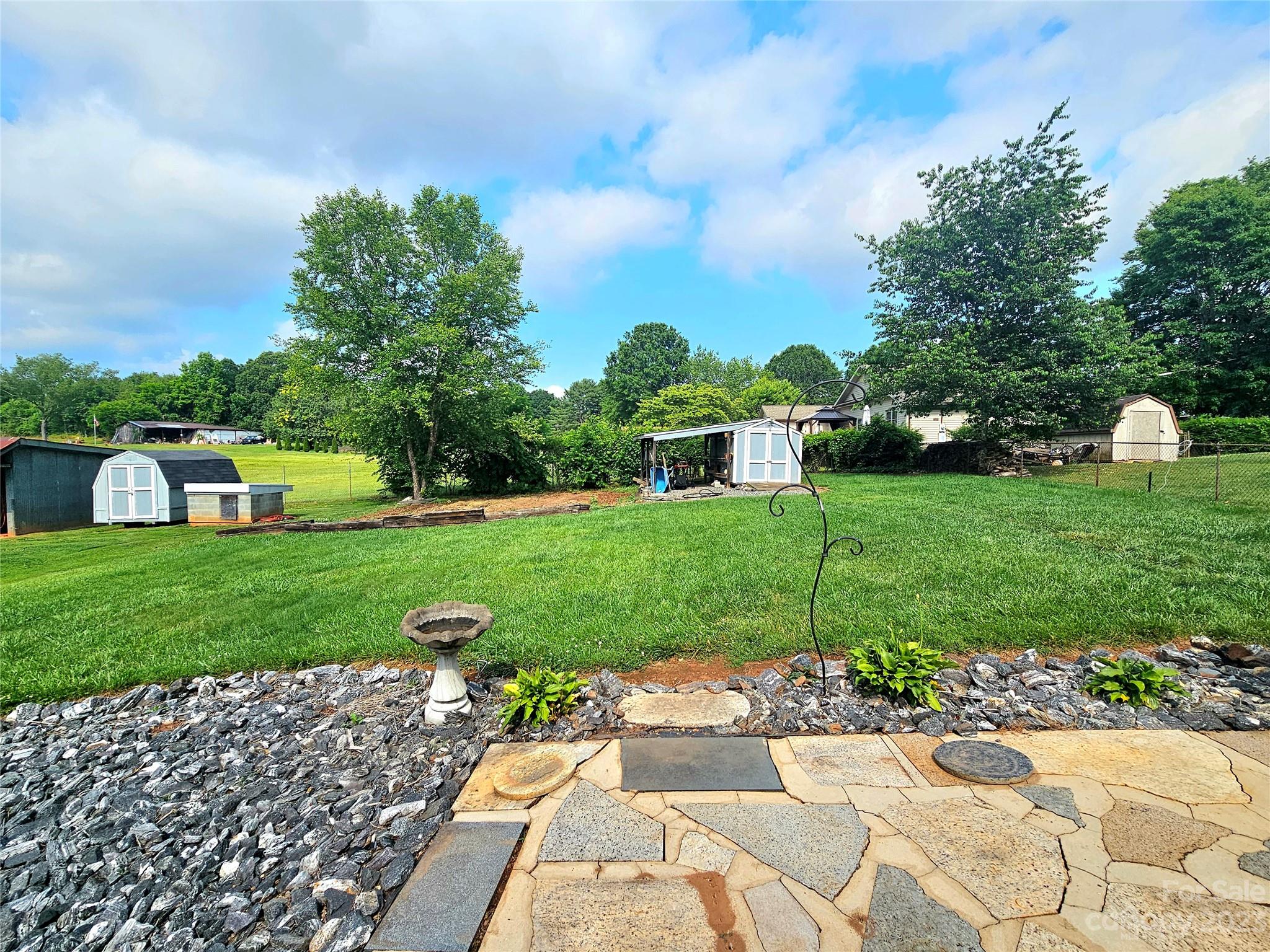 825 Reynolds Road Statesville, NC 28677 - Photo 26 of 26 a view of a garden with a fountain