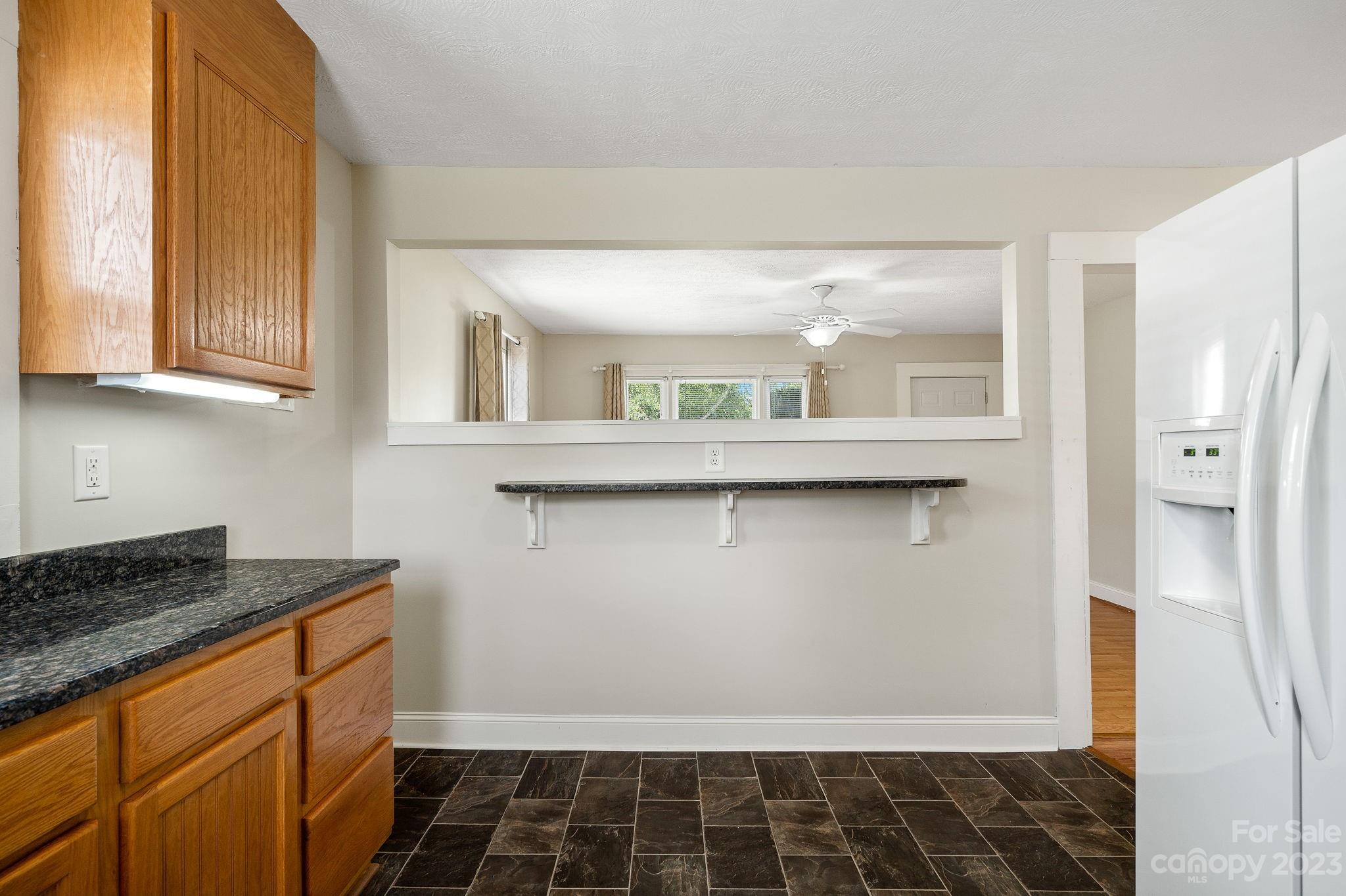 825 Reynolds Road Statesville, NC 28677 - Photo 10 of 26 a kitchen with granite countertop a sink and a stove