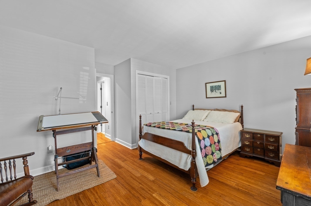 27 R West Street, Unit 4 Beverly, MA 01915 - Photo 19 of 27 a bedroom with a bed and a night stand