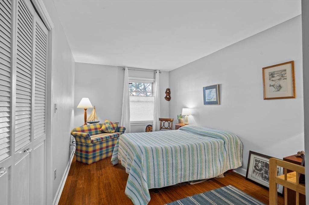27 R West Street, Unit 4 Beverly, MA 01915 - Photo 8 of 27 a bedroom with a bed and wooden floor