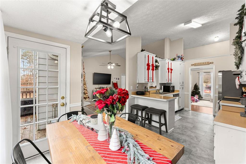 2980 Phillips Bend Crossing Northeast Buford, GA 30519 - Photo 13 of 45 a living room with furniture and a potted plant