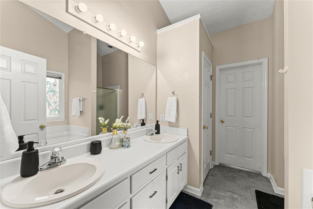 2980 Phillips Bend Crossing Northeast Buford, GA 30519 - Photo 19 of 45 a bathroom with a sink double vanity and a mirror