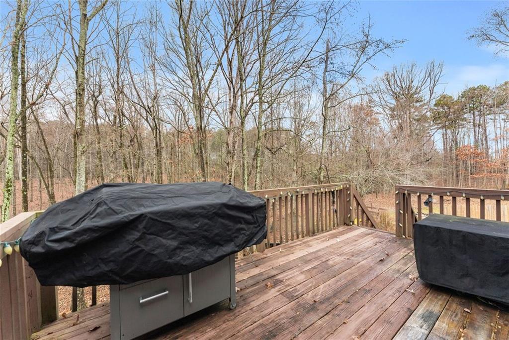 2980 Phillips Bend Crossing Northeast Buford, GA 30519 - Photo 36 of 45 a view of a wooden deck next to a yard