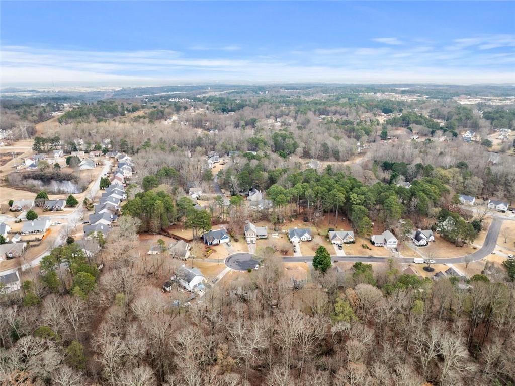 2980 Phillips Bend Crossing Northeast Buford, GA 30519 - Photo 43 of 45 an aerial view of a city with lots of residential buildings