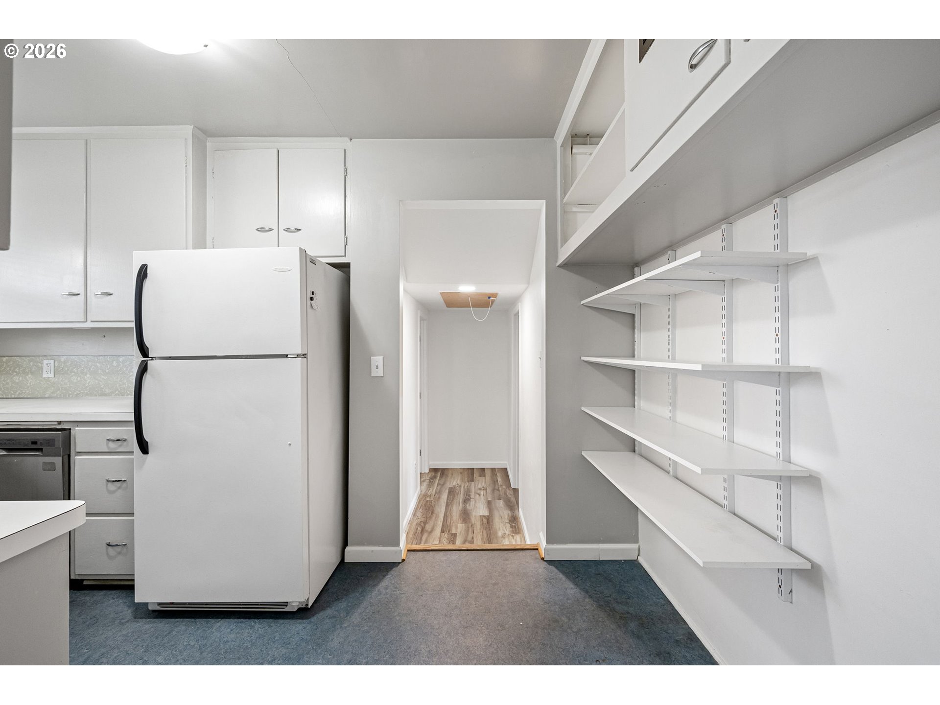 1565 Linwood Street Eugene, OR 97404 - Photo 13 of 42 a kitchen with a refrigerator and a refrigerator