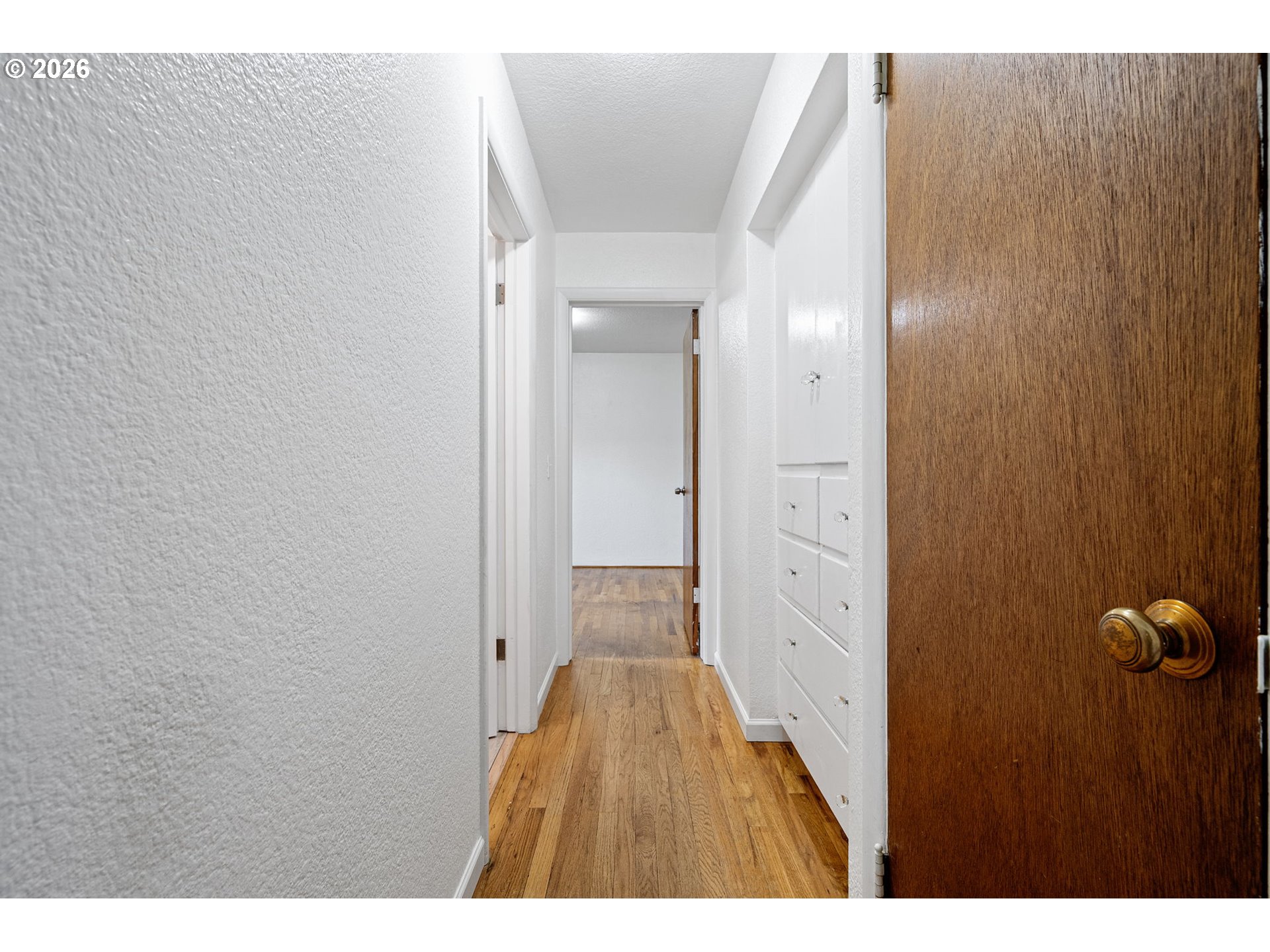 1565 Linwood Street Eugene, OR 97404 - Photo 17 of 42 a view of a hallway with wooden floor