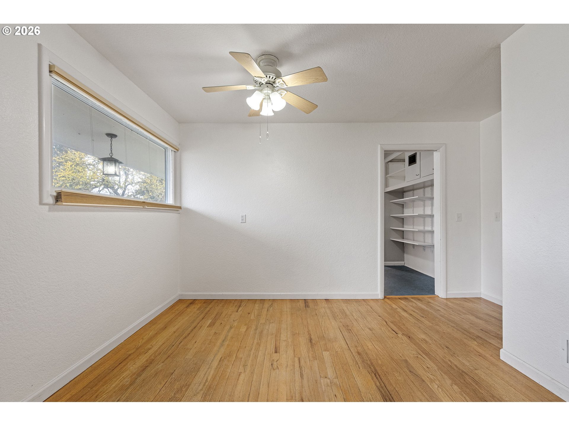 1565 Linwood Street Eugene, OR 97404 - Photo 19 of 42 a view of empty room with wooden floor