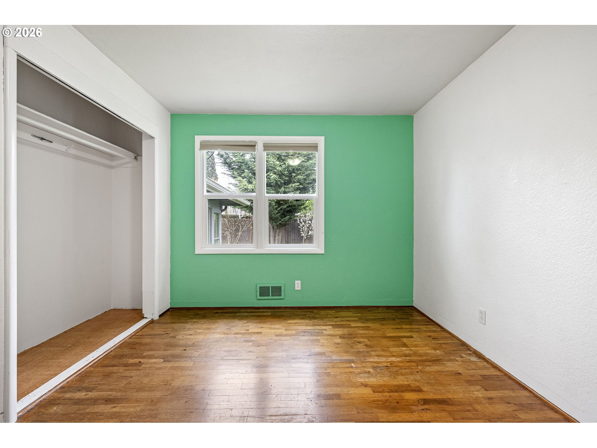 1565 Linwood Street Eugene, OR 97404 - Photo 23 of 42 a room with window and wooden floor