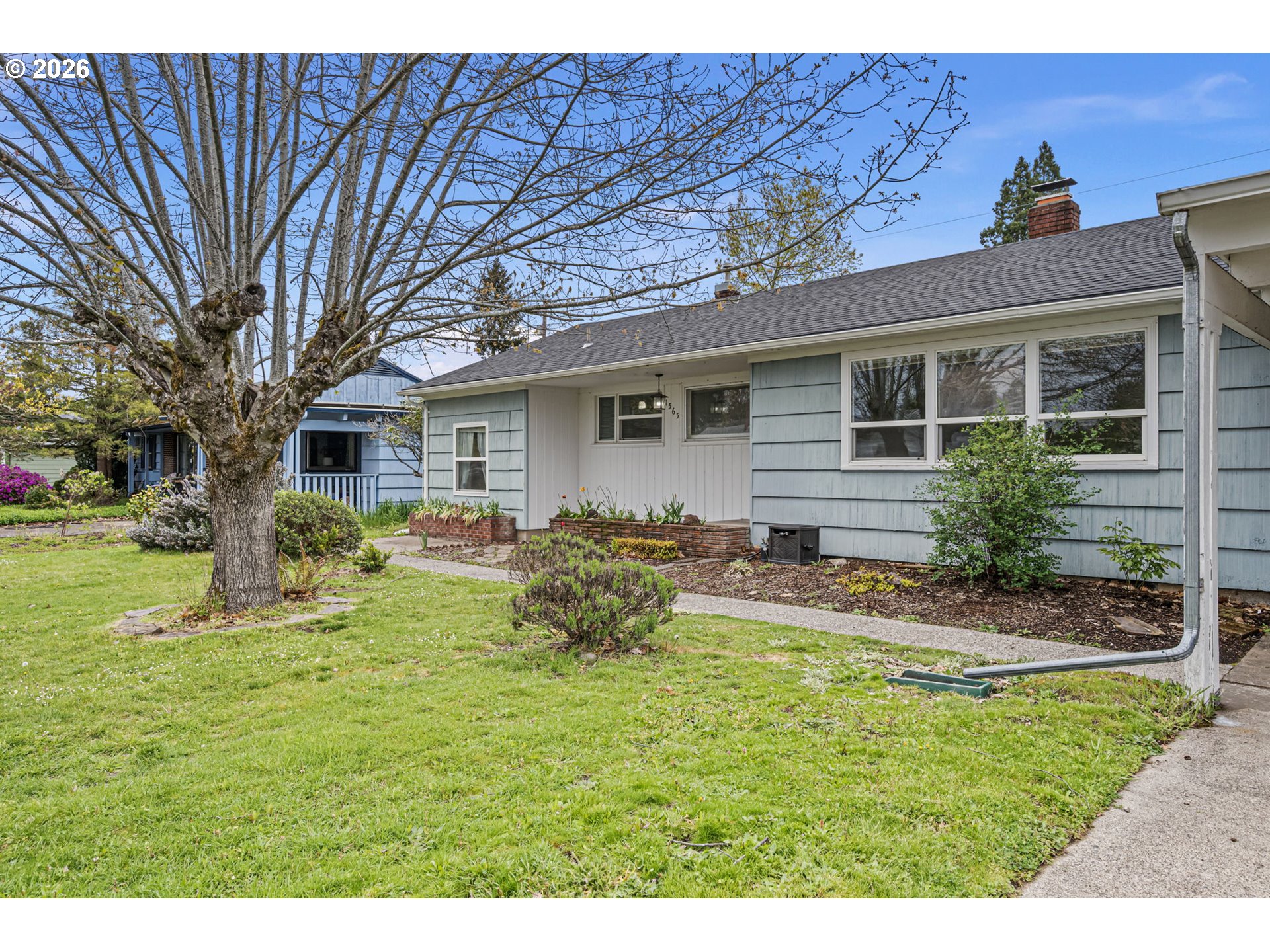 1565 Linwood Street Eugene, OR 97404 - Photo 3 of 42 a view of a house with a yard