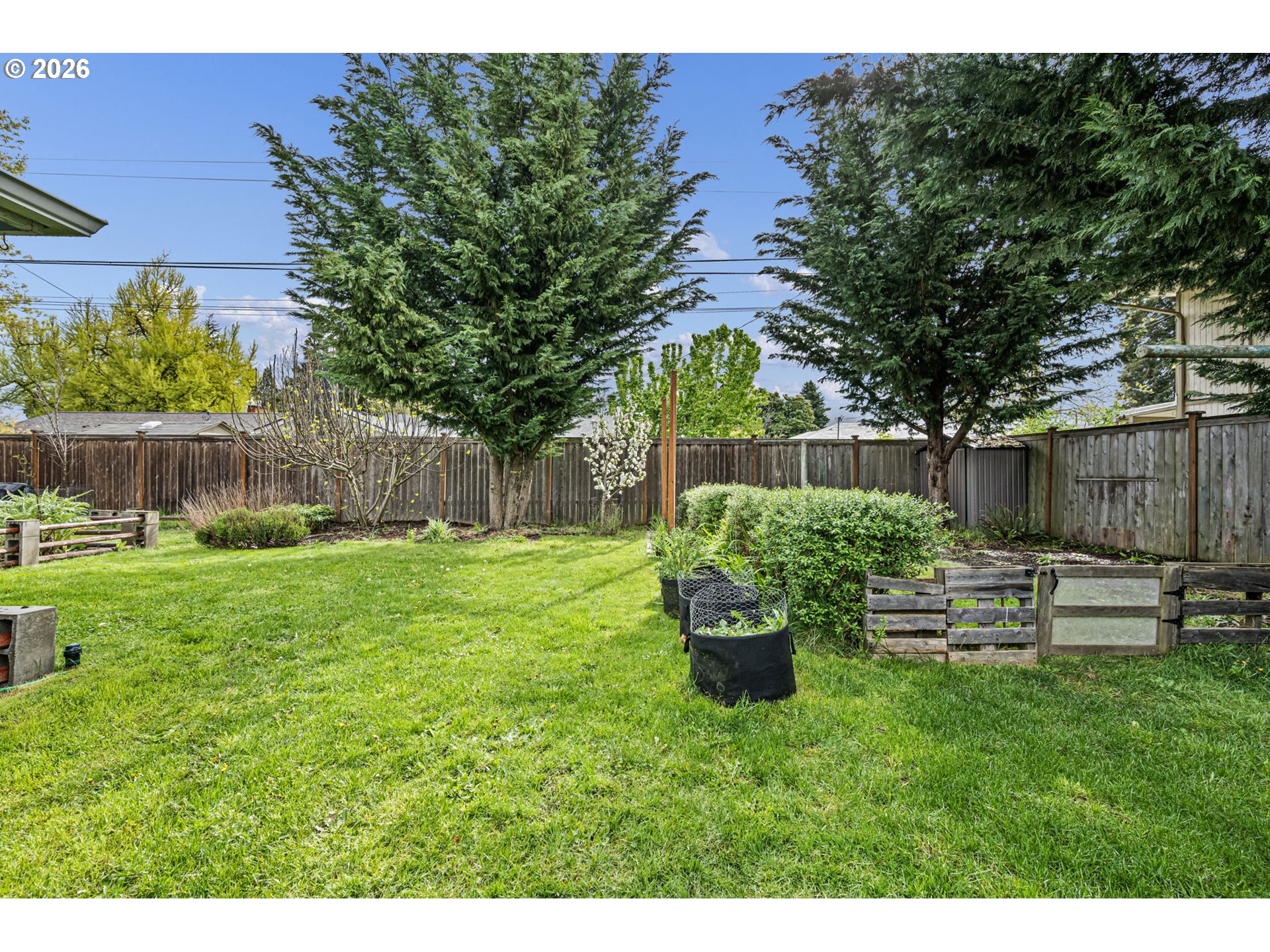 1565 Linwood Street Eugene, OR 97404 - Photo 33 of 42 a garden with a bench in the garden