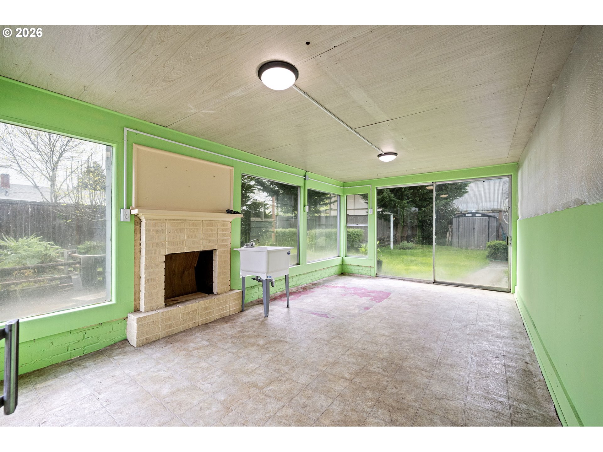 1565 Linwood Street Eugene, OR 97404 - Photo 36 of 42 a view of a room with furniture wooden floor and a fireplace