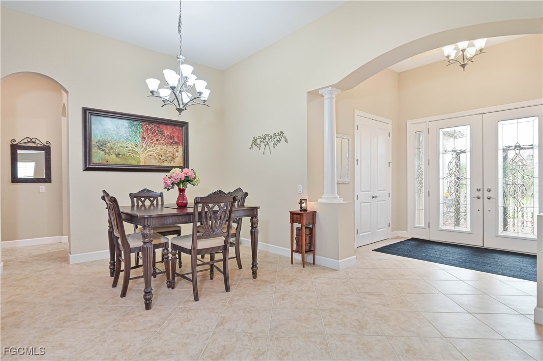 17283 Walnut Run Drive Alva, FL 33920 - Photo 16 of 49 a view of a dining room with furniture and a chandelier