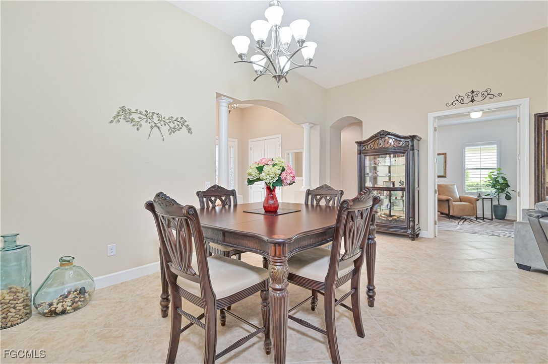 17283 Walnut Run Drive Alva, FL 33920 - Photo 17 of 49 a view of a dining room with furniture and chandelier