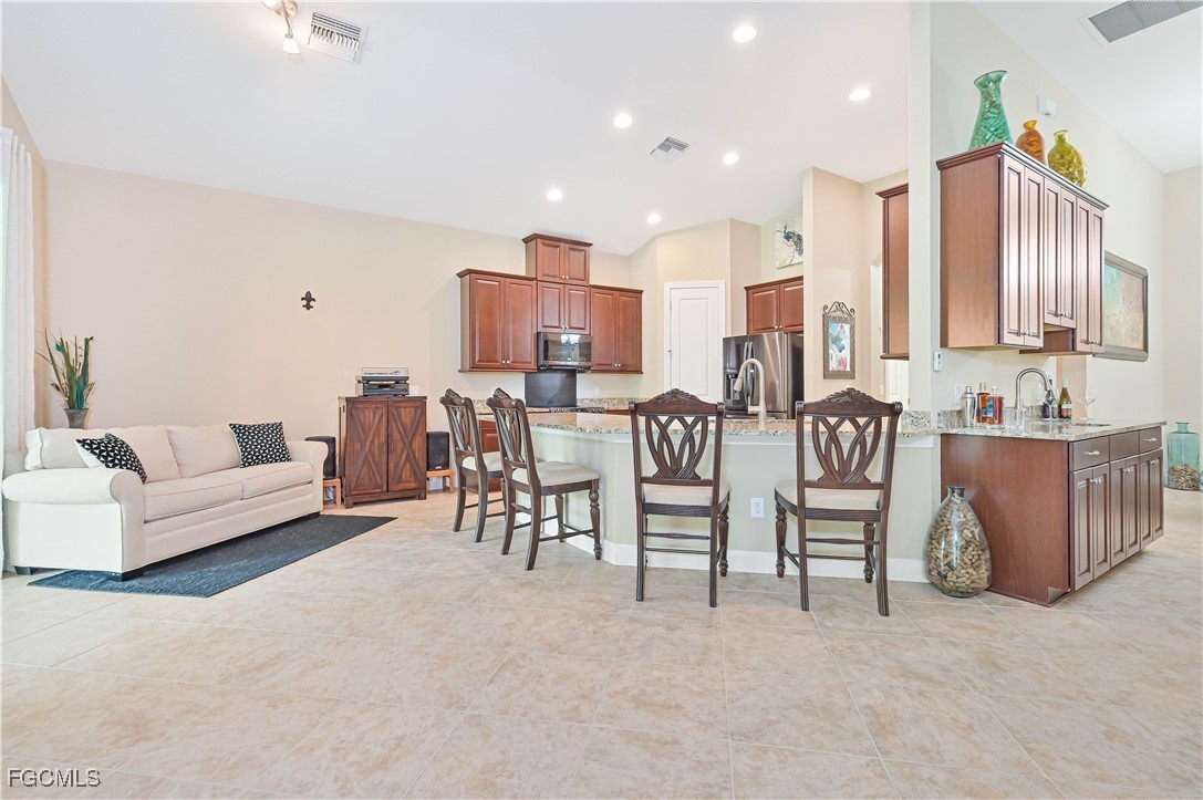 17283 Walnut Run Drive Alva, FL 33920 - Photo 18 of 49 a living room with furniture and a large window