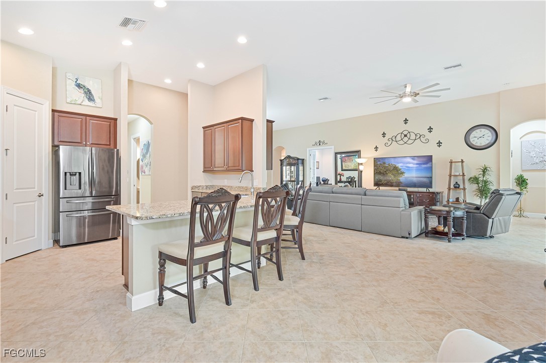 17283 Walnut Run Drive Alva, FL 33920 - Photo 19 of 49 a large kitchen with a table and chairs