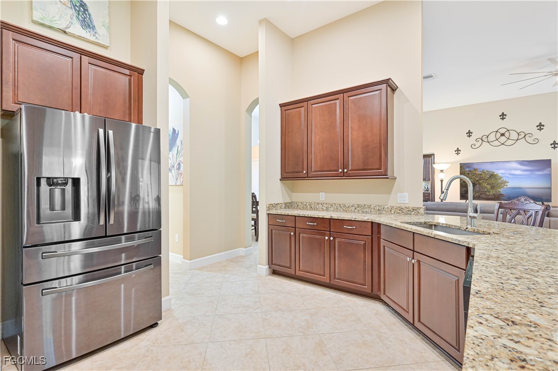 17283 Walnut Run Drive Alva, FL 33920 - Photo 20 of 49 a kitchen with stainless steel appliances granite countertop a refrigerator and a sink