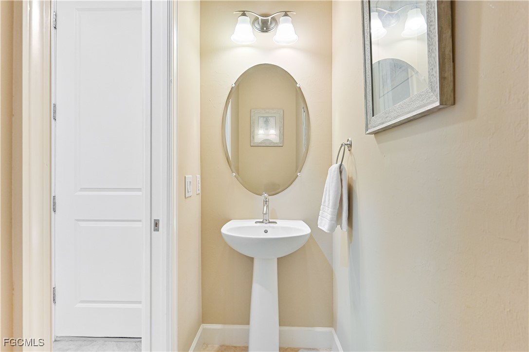 17283 Walnut Run Drive Alva, FL 33920 - Photo 24 of 49 a bathroom with a sink and a mirror