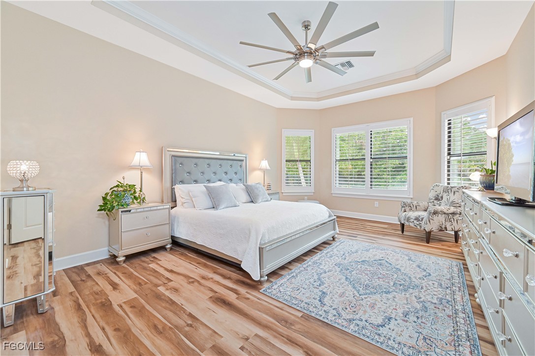 17283 Walnut Run Drive Alva, FL 33920 - Photo 27 of 49 a spacious bedroom with a large bed and a flat screen tv