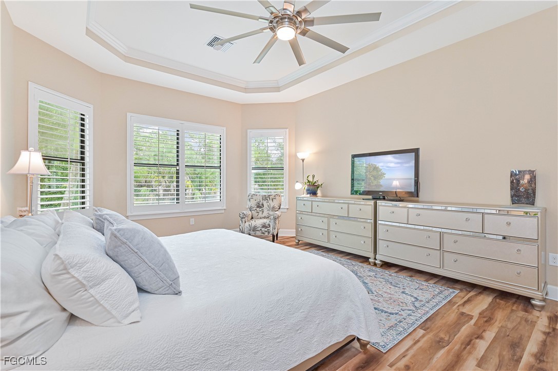 17283 Walnut Run Drive Alva, FL 33920 - Photo 28 of 49 a bedroom with a bed and a flat screen tv